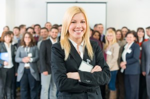 Woman with staff behind here